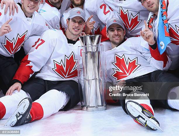 Sidney Crosby and John Tavares of Team Canada celebrate a victory over Team Europe during Game Two of the World Cup of Hockey final series at the Air...