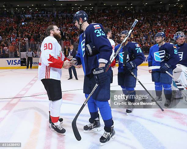 Ryan O'Reilly of Team Canada shakes hands with Zdeno Chara of Team Europe following Game Two of the World Cup of Hockey final series at the Air...
