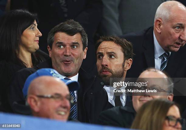 Gareth Southgate caretaker manager of England and Roy Keane assistant manager of the Republic of Ireland look on from the stand prior to the Premier...