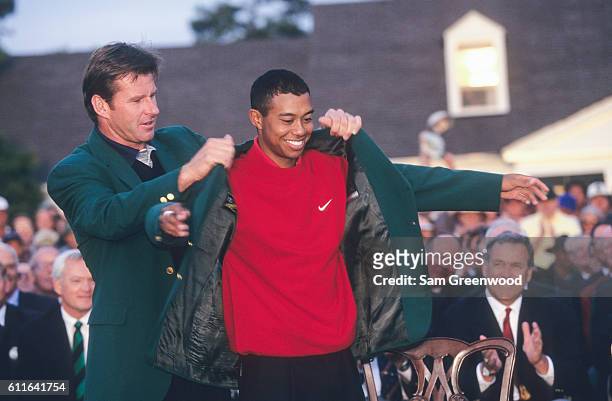 Tiger Woods and Nick Faldo of England during the final round of the 1997 Masters Tournament at the Augusta National Golf Club on April 13, 1997 in...