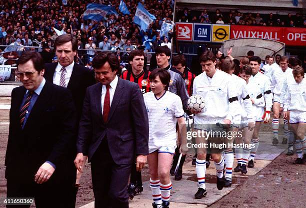 Chelsea Manager John Hollins and Manchester City Manager Billy McNeill lead out the teams.