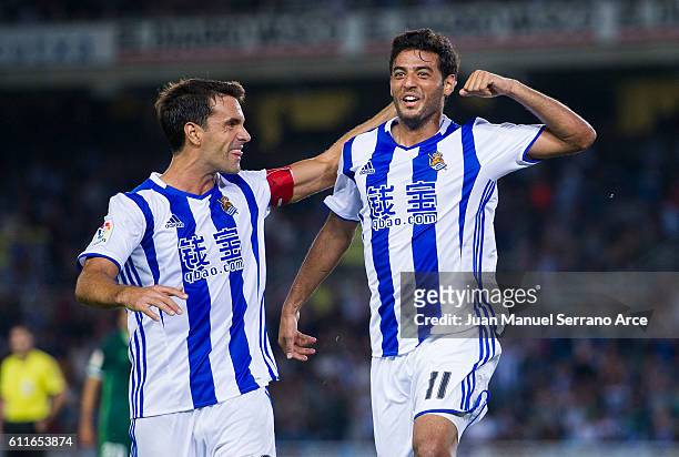 Carlos Vela of Real Sociedad celebrates with his teammate Xabier Prieto of Real Sociedad after scoring the opening goal during the La Liga match...