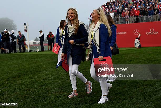 Erica Stoll and Caroline Harrington walk off the first tee during morning foursome matches of the 2016 Ryder Cup at Hazeltine National Golf Club on...