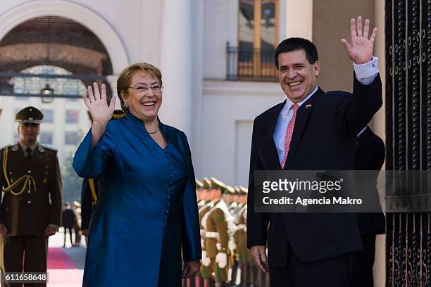 President of Chile, Michelle Bachelet , and President of the Republic of Paraguay Horacio Cartes , greet to the press at the Palacio de La Moneda on...
