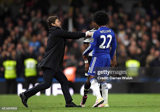 Tottenham Hotspur manager Mauricio Pochettino steps onto the pitch to separate Tottenham Hotspur's Danny Rose and Chelsea's Willian