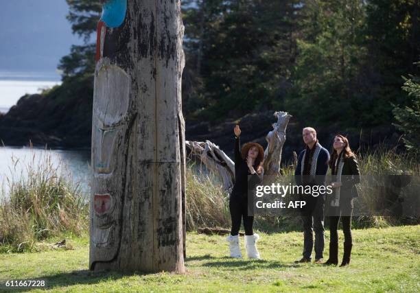 The Duke and Duchess of Cambridge, view a totem pole during a visit to the Haida Heritage Centre and Museum in Haida Gwaii, British Columbia, on...