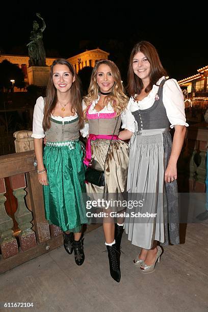 Charlotte Hermann and her sister Sophie Hermann and stepsister Julia Tewaag, Julia Frank, daughter of Uschi Glas during the Oktoberfest at...