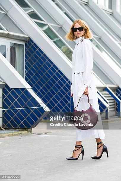 Fashion blogger Candela Novembre poses after the Issey Miyake show on day 4 of Paris Womens Fashion Week Spring/Summer 2017,Êon September 30, 2016 in...