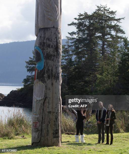 The Duke and Duchess of Cambridge, view a totem pole during a visit to the Haida Heritage Centre and Museum in Haida Gwaii, British Columbia on...