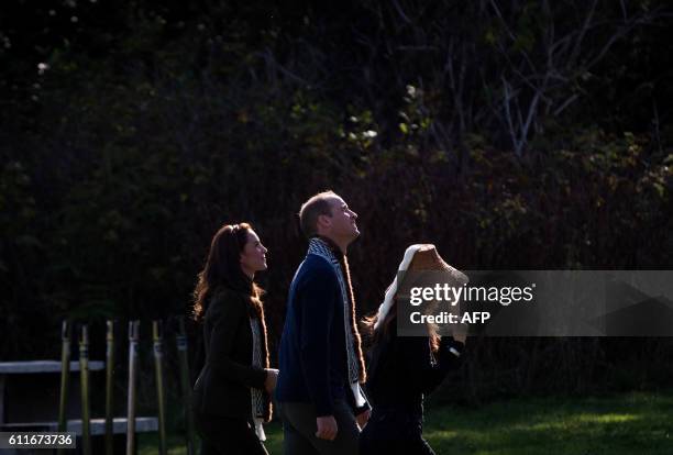 The Duke and Duchess of Cambridge, view totem poles at the Haida Heritage Centre and Museum in Haida Gwaii, British Columbia on September 30, 2016.