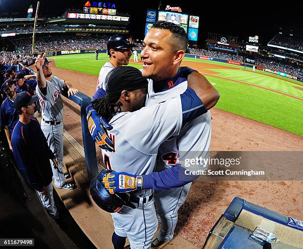 Miguel Cabrera of the Detroit Tigers is congratulated by Cameron Maybin after hitting a third inning solo home run against the Atlanta Braves at...