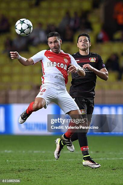 Joao Moutinho of AS Monaco FC is challenged by Javier Hernandez of Bayer 04 Leverkusen during the UEFA Champions League Group E match between AS...