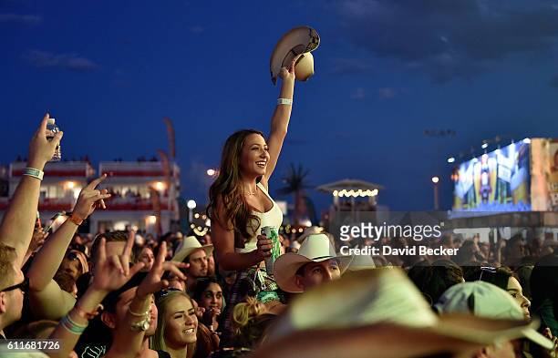 Fan cheers during the Route 91 Harvest country music festival at the Las Vegas Village on September 30, 2016 in Las Vegas, Nevada.