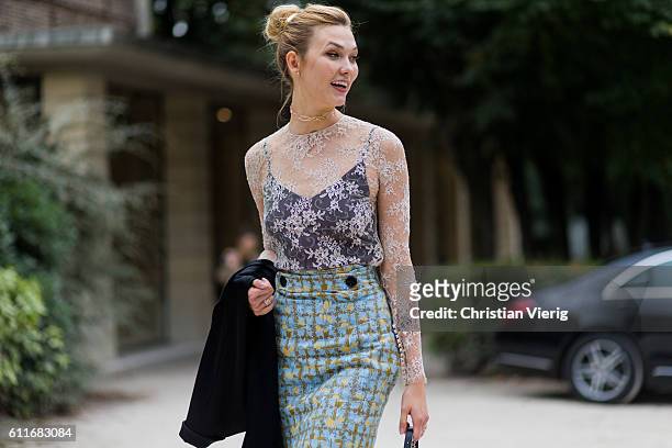 Model Karlie Kloss outside Dior on September 30, 2016 in Paris, France.