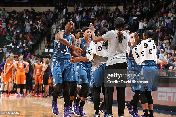 The Minnesota Lynx celebrate during the game against the Phoenix Mercury in Game Two of the Semifinals during the 2016 WNBA Playoffs on September 30,...