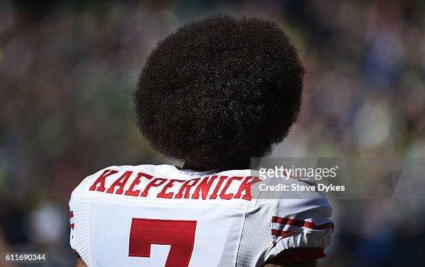 Quarterback Colin Kaepernick of the San Francisco 49ers looks on from the sidelines before the game against the Seattle Seahakws at CenturyLink Field...