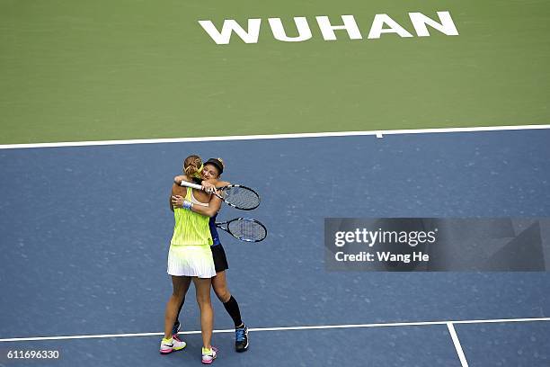 Bethany Mattek Sands of USA and Lucie Safarova of Czech celebrates after they won the doubles final match against Santa Mirza of India and Barbora...