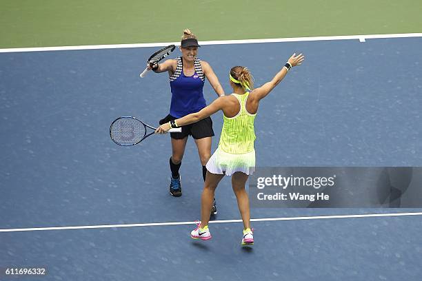 Bethany Mattek Sands of USA and Lucie Safarova of Czech celebrates after they won the doubles final match against Santa Mirza of India and Barbora...