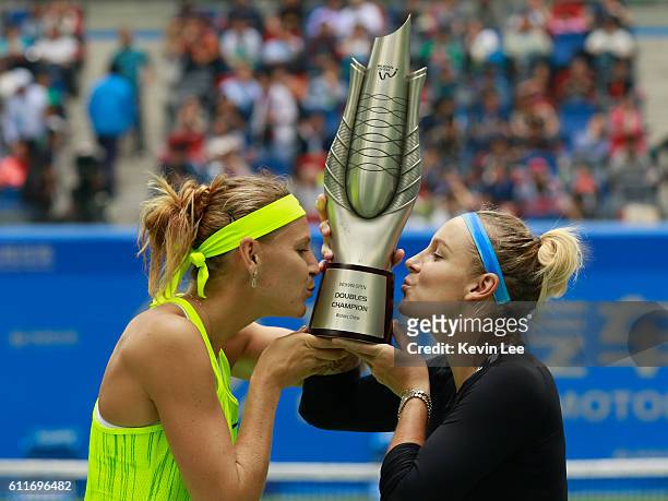 Lucie Safarova of Czech Republic and Bethanie Mattek-Sands of United States kiss the trophy after winning the double match of 2016 Dongfeng Motor...