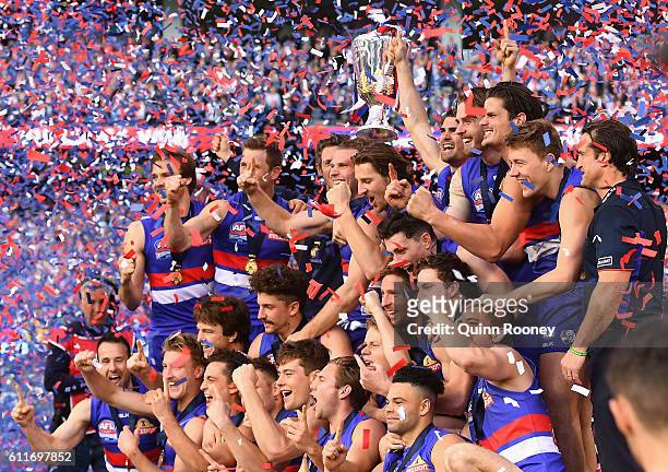 The Western Bulldogs pose with the Premiership Cup after winning the 2016 AFL Grand Final match between the Sydney Swans and the Western Bulldogs at...