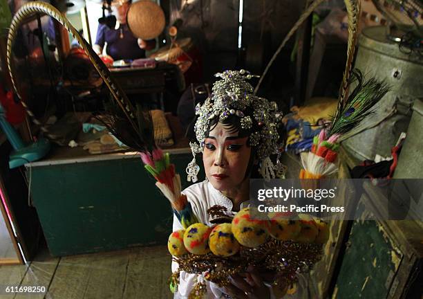 Actor Chinese opera while Make up prepare show at Chinese shrine during Chinese opera of The faculty Lao Gheg Lao Cung show for Vegetarian Festival...
