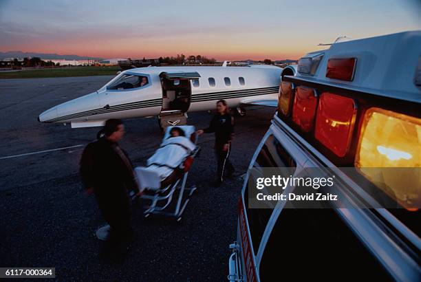 private airplane and ambulance - jet lag stockfoto's en -beelden