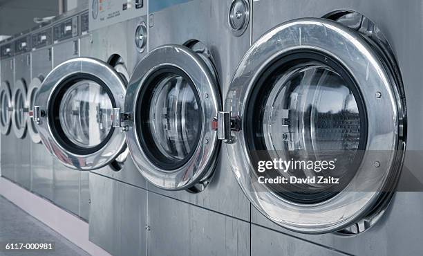 washing machines in laundromat - laundry stock pictures, royalty-free photos & images