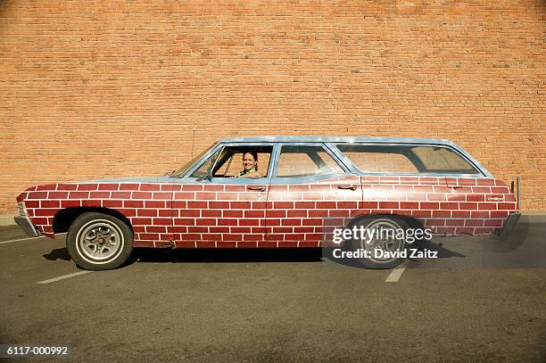 brick pattern on station wagon - crazy car fotografías e imágenes de stock