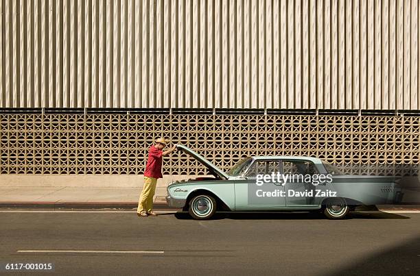 man opening automobile hood - los angeles events ストックフォトと画像