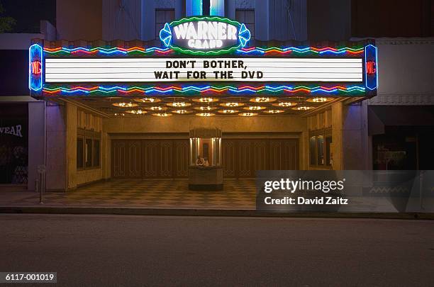 movie theater sign - light letters stock-fotos und bilder