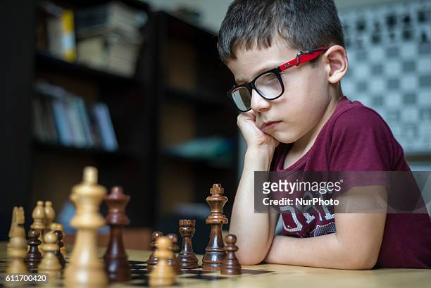 Learner of the Quba Chess School plays chess during a training lesson, Azerbaijan. Sports schools, especially chess schools, are supported by the...