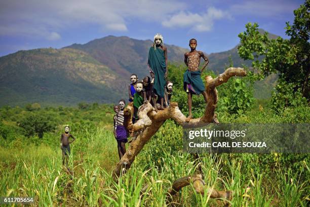 Children from the Suri tribe pose in Ethiopia's southern Omo Valley region near Kibbish on September 25, 2016. The Suri are a pastoralist Nilotic...