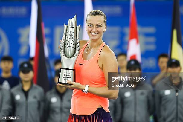 Petra Kvitova of the Czech Republic poses with the trophy after winning the women's single final match against Dominika Cibulkova of Slovak on day...