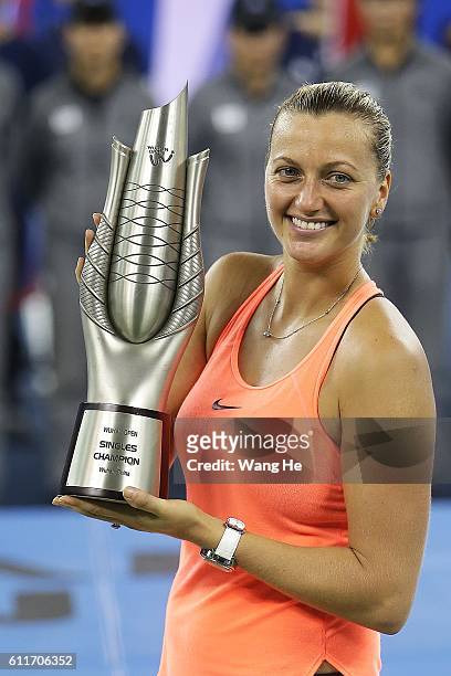 Winners Petra Kvitova of Czech pose for a picture with their trophy on day 7 of 2016 Dongfeng Motor Wuhan Open at Optics Valley International Tennis...