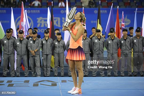 Winners Petra Kvitova of Czech pose for a picture with their trophy on day 7 of 2016 Dongfeng Motor Wuhan Open at Optics Valley International Tennis...