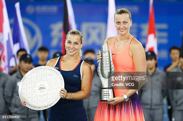 First place Petra Kvitova of the Czech Republic and second place Dominika Cibulkova of Slovak pose with the trophies after the women's single final...