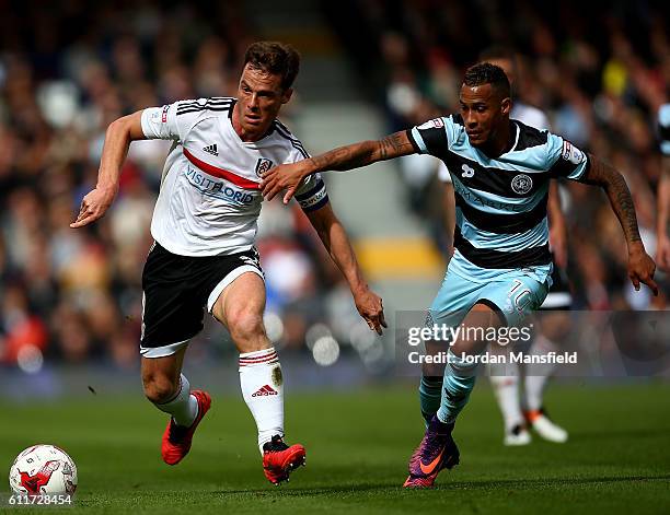 Scott Parker of Fulham holds off pressure from Tjaronn Chery of QPR during the Sky Bet Championship match between Fulham and Queens Park Rangers at...