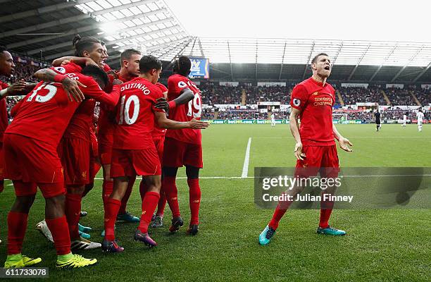 James Milner of Liverpool celebrates scoring his sides second goal during the Premier League match between Swansea City and Liverpool at Liberty...