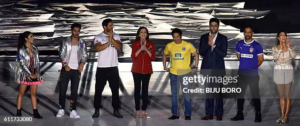 Founder and Chairperson, Indian Super League Nita Ambani is watched by Bollywood actors Varun Dhawan , John Abraham , Abhishek Bachchan and former...