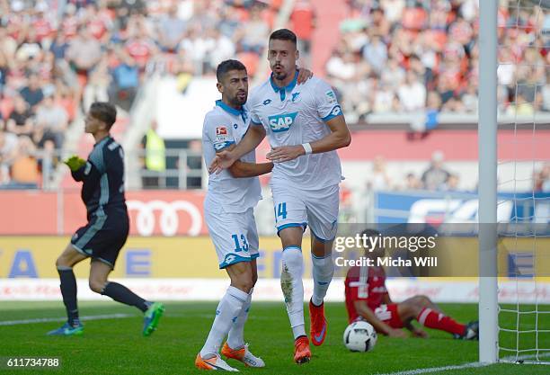 Sandro Wagner of Hoffenheim celebrates with Kerem Demirbay of Hoffenheim after scoring the opening/first goal during the Bundesliga match between FC...