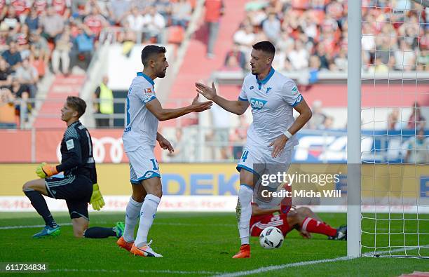 Sandro Wagner of Hoffenheim celebrates with Kerem Demirbay of Hoffenheim after scoring the opening/first goal during the Bundesliga match between FC...