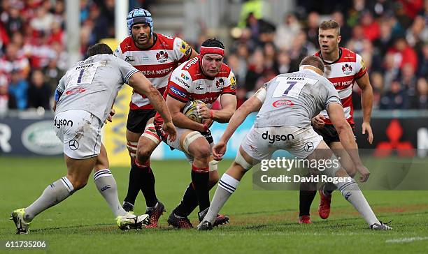 Ben Morgan of Gloucester is tackled by Nathan Catt and Tom Ellis during the Aviva Premiership match between Gloucester and Bath at Kingsholm Stadium...
