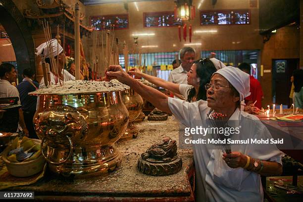 Member of a Malaysian ethnic Chinese community perform a prayer during the 2nd day of Nine Emperor Gods Festival at a temple on October 1, 2016 in...