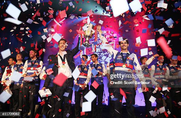 Robert Murphy of the Bulldogs and Easton Wood of the Bulldogs celebrate with the 2016 AFL Premiership Cup during the Western Bulldogs 2016 AFL...