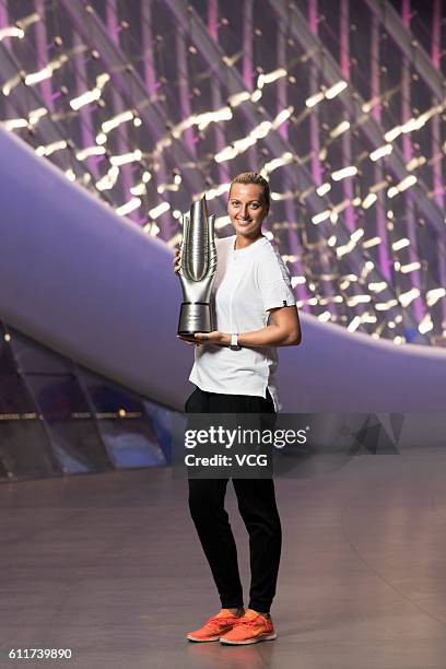 Petra Kvitova of the Czech Republic poses with the trophy for the champion portrait after winning the women's single final match against Dominika...