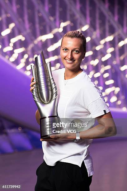 Petra Kvitova of the Czech Republic poses with the trophy for the champion portrait after winning the women's single final match against Dominika...