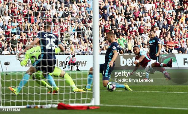 Dimitri Payet of West Ham United scores his sides first goal during the Premier League match between West Ham United and Middlesbrough at London...