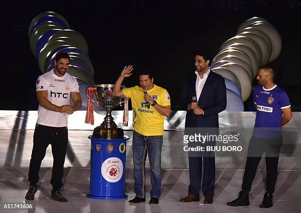 Former Indian cricketer and Kerala Blasters FC co-owner Sachin Tendulkar speaks as Indian cricketer and Chennaiyin FC co-owner Mahendra Singh Dhoni...