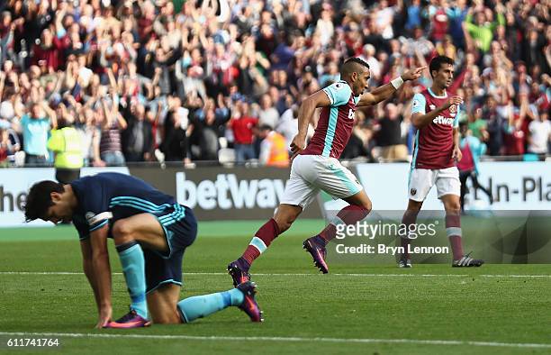 Dimitri Payet of West Ham United celebrates scoring his sides first goal during the Premier League match between West Ham United and Middlesbrough at...