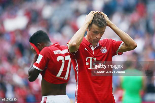 Thomas Mueller and David Alaba of Muenchen react after the Bundesliga match between Bayern Muenchen and 1. FC Koeln at Allianz Arena on October 1,...